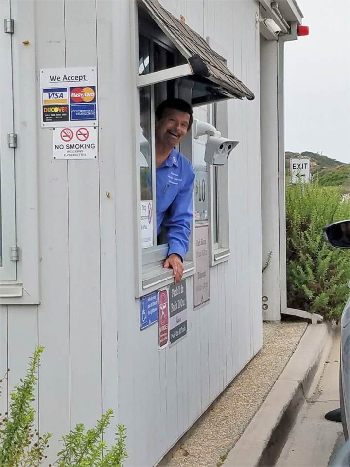 VIP Peter leans smiling out of a window at Cabrillo’s entrance station.