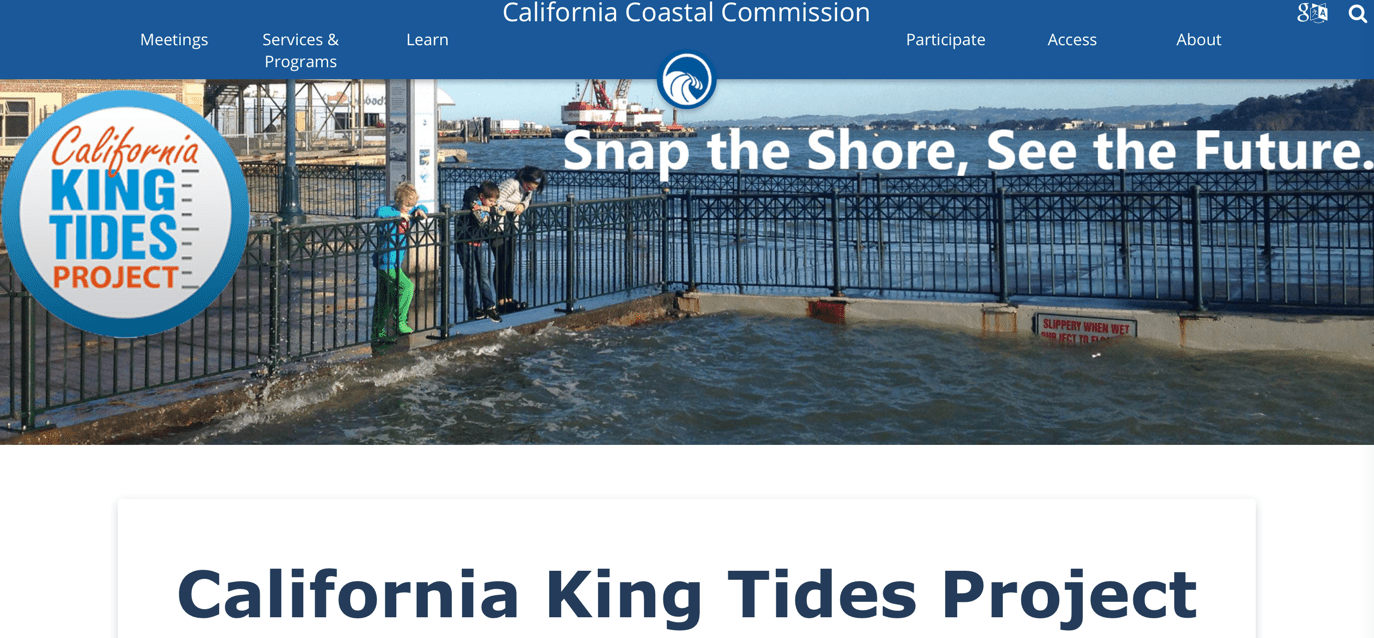 People looking over a railing at high water from flooding.