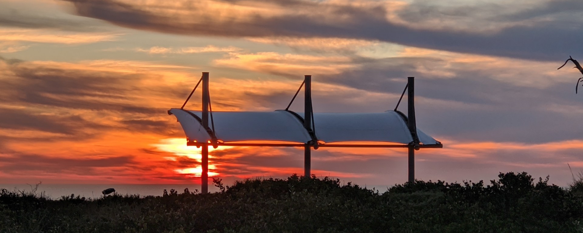 A fiery red sunset over the Pacific Ocean viewed from the Kelp Forest Overlook at Cabrillo National Monument.