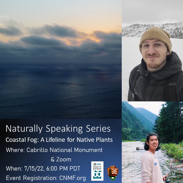 A man in a winter coat and hat stands in the snow and a man stands next to a river.