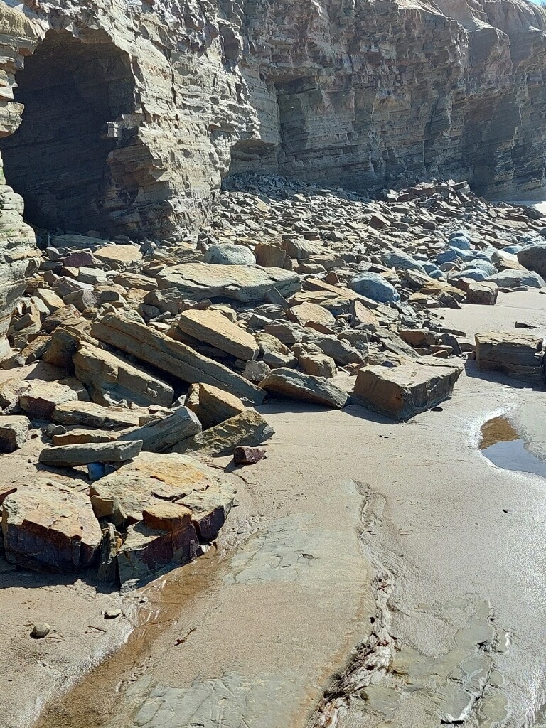 A pile of rocks that fell down from the sandstone cliffs.