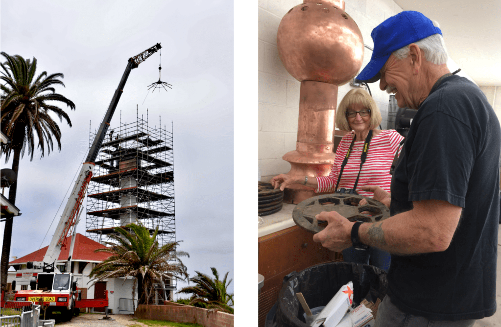 A lighthouse surrounded by scaffolding and a man holding a movie reel with a woman looking on.